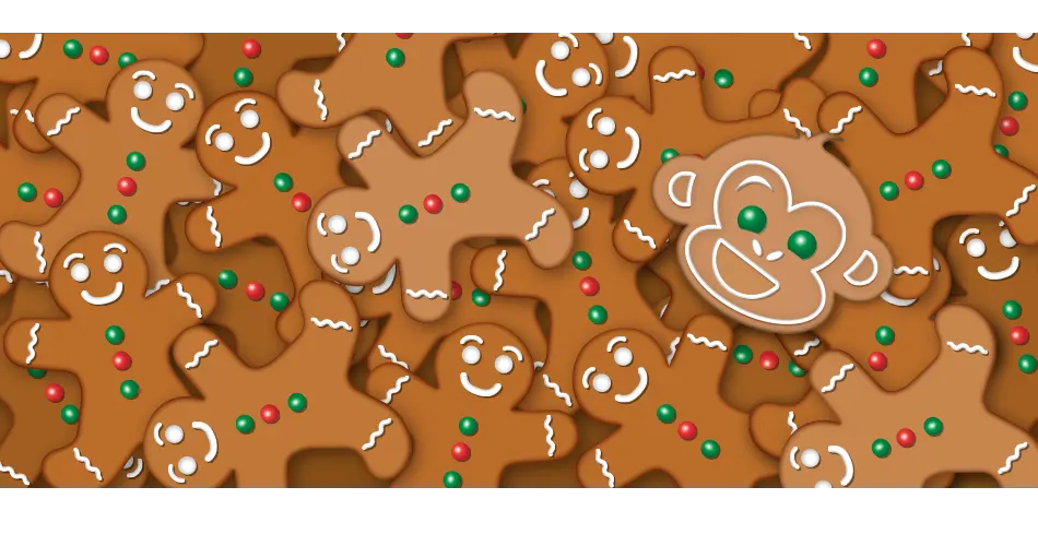 Monkey faced cookie on a pile of gingerbread men